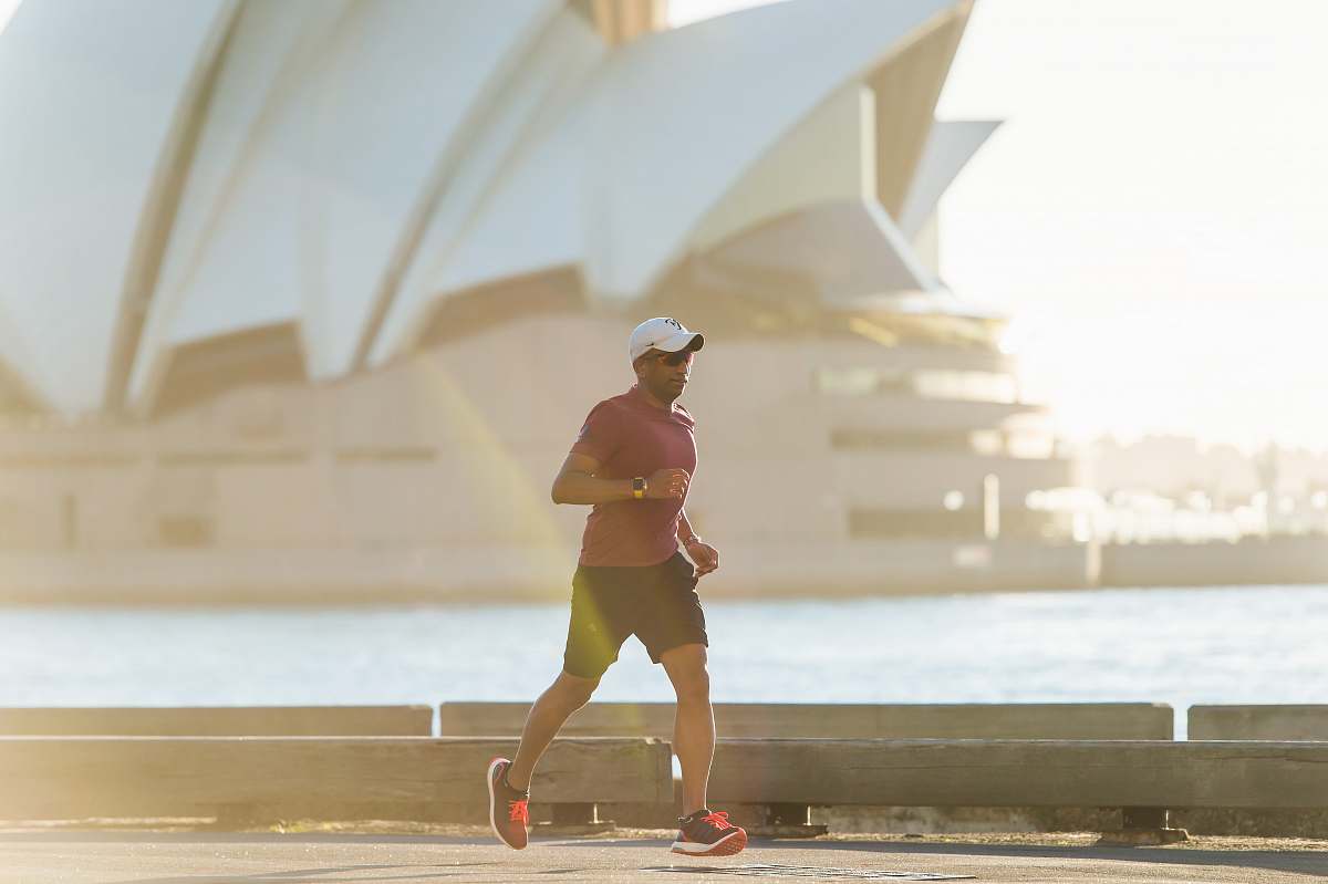 working out man running near Sydney Opera House exercise